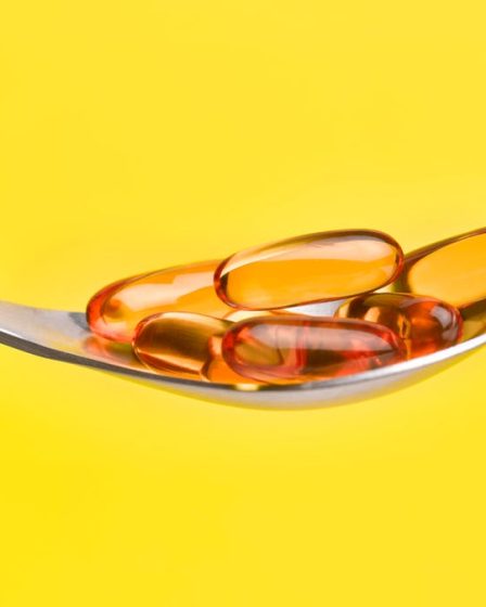 A spoon full of fish oil supplements