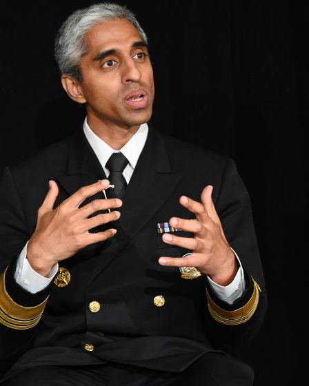 U.S. Surgeon General Vivek Murthy gestures with his hands as he talks.