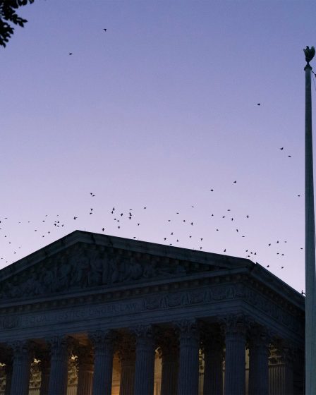 A photo of the Supreme Court's exterior at sunrise.
