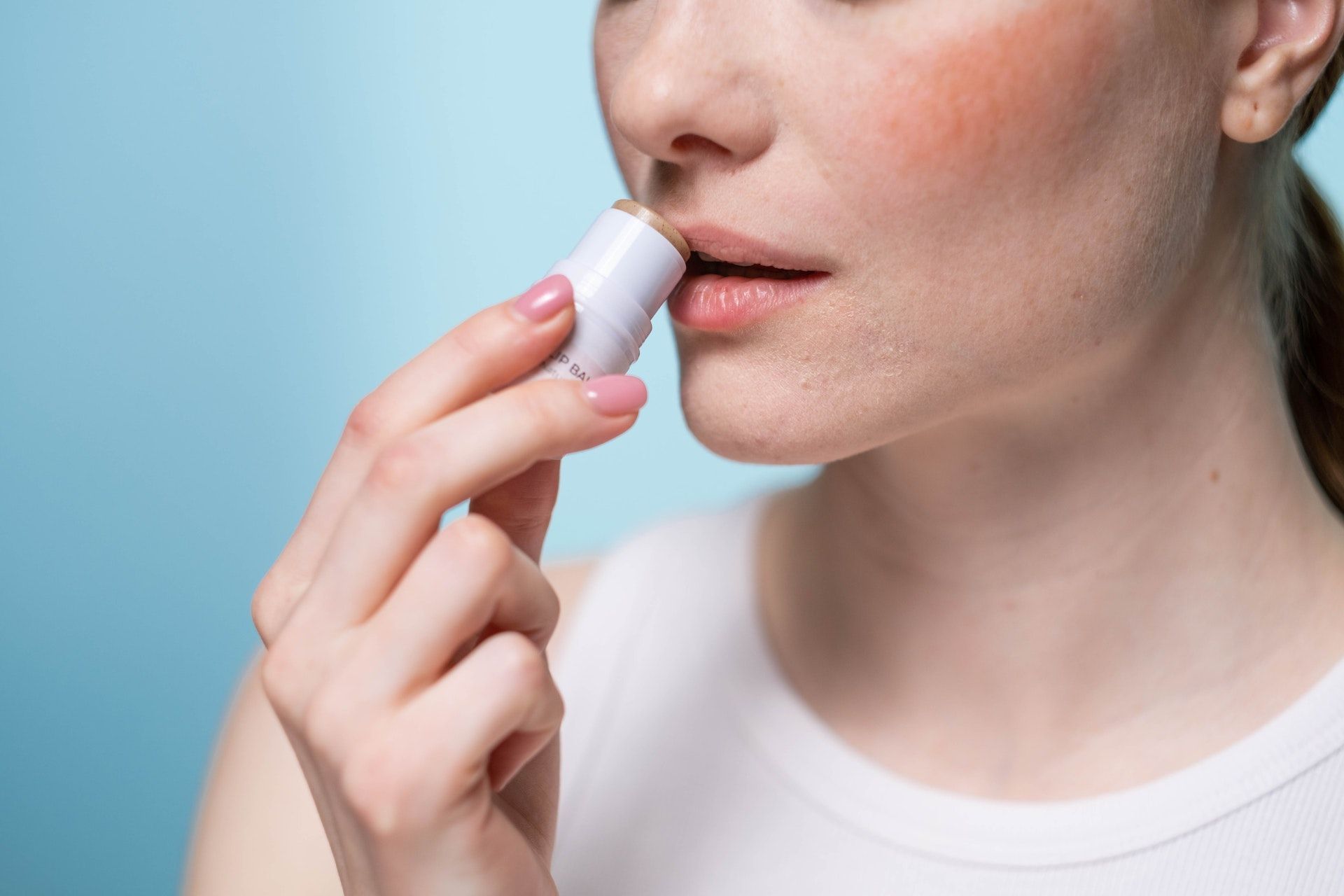 Avoid menthol-based lip balms.  (Photo via Pexels/MART PRODUCTION)