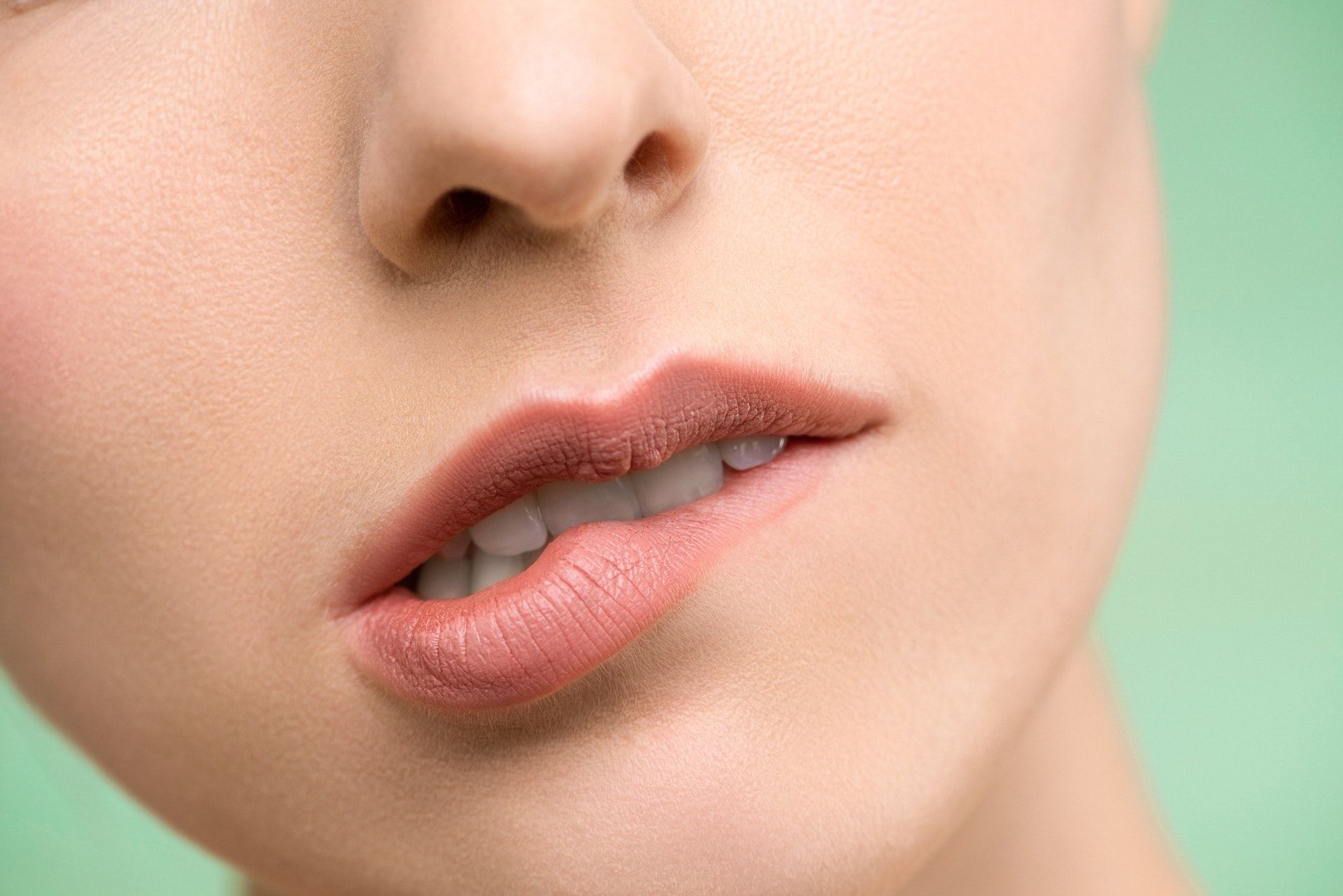 Avoid biting your lips.  (Photo via Pexels/Shining Diamond)