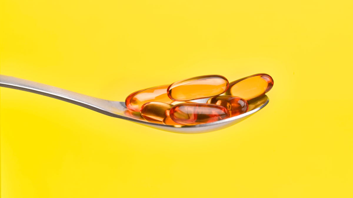 A spoon full of fish oil supplements
